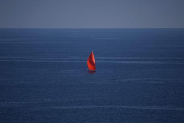 (FILES) This photograph shows a sailboat on the Mediterranean ocean from Roquebrune-Cap-Martin, south-eastern France on April 9, 2026. The European Union's climate monitor said on May 8, 2026 that ocean temperatures are edging toward record highs as conditions shift toward a potentially powerful El Nino weather pattern. (Photo by Valery HACHE / AFP)