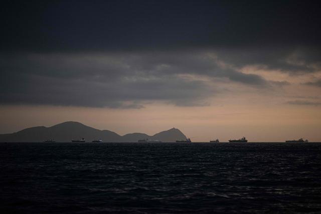 (FILES) Image of merchant ships on the horizon in front of the port of El Callao in Lima on November 18, 2023. The European Union's climate monitor said on May 8, 2026 that ocean temperatures are edging toward record highs as conditions shift toward a potentially powerful El Nino weather pattern. (Photo by Ernesto BENAVIDES / AFP)