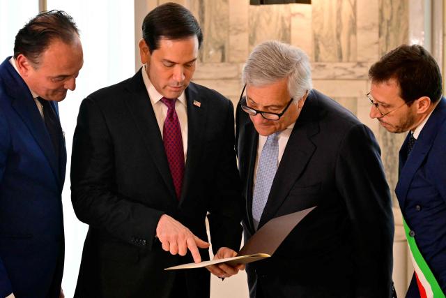 Italy's Deputy Prime Minister and Foreign Minister, Antonio Tajani (2ndR), Piedmont Region President Alberto Ciro (L) and Mayor of Casal Monferrato Emanuele Capra (R) present to U.S. Secretary of State Marco Rubio (2ndL) the family tree and documents that certify Secretary Rubio's family origins during an Italian Citizenship Conferment Ceremony at the Palazzo della Farnesina, Italy's Foreign Ministry in Rome on May 8, 2026. (Photo by Stefano RELLANDINI / POOL / AFP)