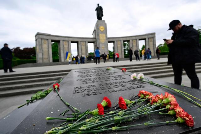 Flowers are laid at a plaque commemorating Soviet soldiers at the Soviet War Memorial Tiergarten in Berlin on May 8, 2026 to commemorate the anniversary of the 1945 victory against Nazi Germany. (Photo by John MACDOUGALL / AFP)