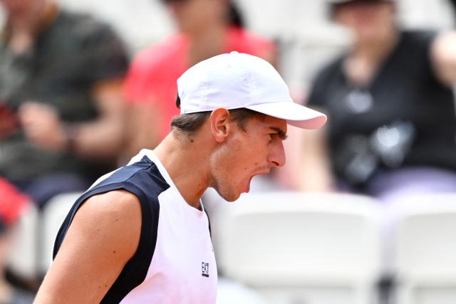 Italy's Matteo Arnaldi reacts as he plays against Australia's Alex de Minaur during their men's singles match of the WTA Rome Open tennis tournament at the Foro Italico in Rome on May 8, 2026. (Photo by Tiziana FABI / AFP)