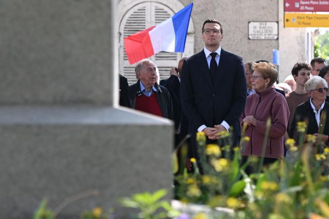 French far-right Rassemblement National RN party's President Jordan Bardella (C) attends a ceremony marking the 81st anniversary of VE Day, or Victory in Europe Day, which commemorates the end of World War II, in La Fleche, north-western France, on May 8, 2026. (Photo by Sebastien Salom-Gomis / AFP)