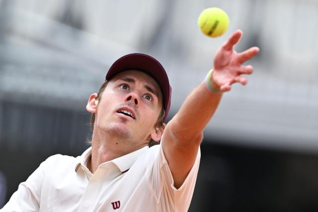 Australia's Alex de Minaur serves to Italy's Matteo Arnaldi during their men's singles match of the WTA Rome Open tennis tournament at the Foro Italico in Rome on May 8, 2026. (Photo by Tiziana FABI / AFP)