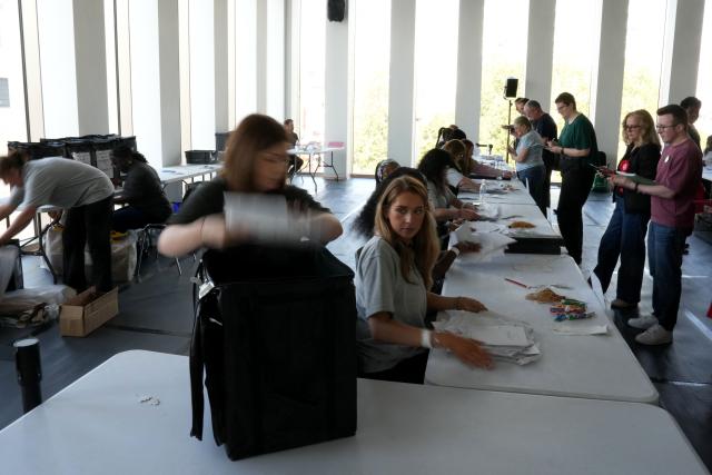Staff count ballots the morning after local elections at a vote-counting centre in Woolwich in south-east London on May 8, 2026. (Photo by CARLOS JASSO / AFP)
