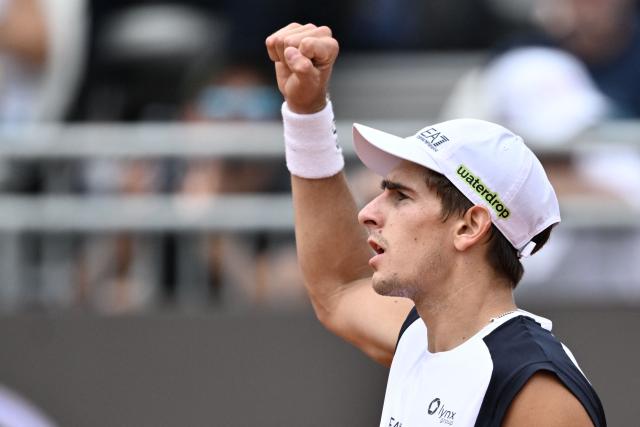 Italy's Matteo Arnaldi reacts after a point as he plays against Australia's Alex de Minaur during their men's singles match of the WTA Rome Open tennis tournament at the Foro Italico in Rome on May 8, 2026. (Photo by Tiziana FABI / AFP)