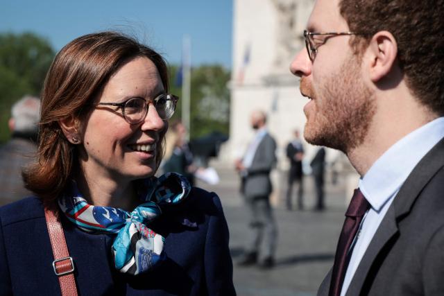 First President of The Cour des Comptes Amelie de Montchalin (L) and France’s junior Minister for Public Accounts David Amiel (R) speak during a ceremony marking the 81st anniversary of Victory in Europe Day, which commemorates the end of the Second World War in Europe, at the Arc de Triomphe, in Paris on May 8, 2026. (Photo by Ludovic MARIN / POOL / AFP)