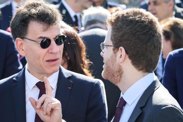 France's Higher Education, Research and Space Minister Philippe Baptiste (L) and France’s junior Minister for Public Accounts David Amiel (R) speak during a ceremony marking the 81st anniversary of Victory in Europe Day, which commemorates the end of the Second World War in Europe, at the Arc de Triomphe, in Paris on May 8, 2026. (Photo by Ludovic MARIN / POOL / AFP)