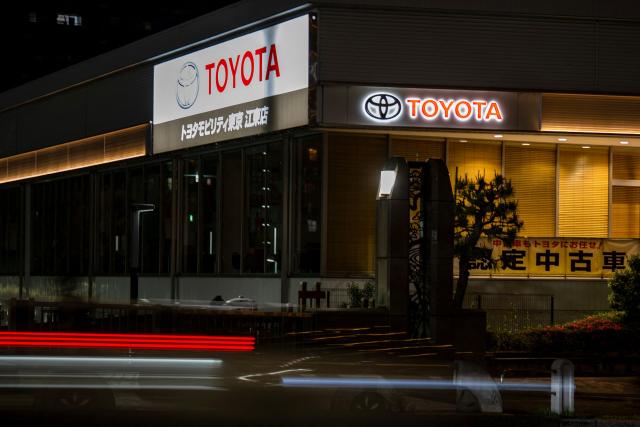 Toyota logos are seen on the side of a store in Tokyo on May 8, 2026. (Photo by Philip FONG / AFP)