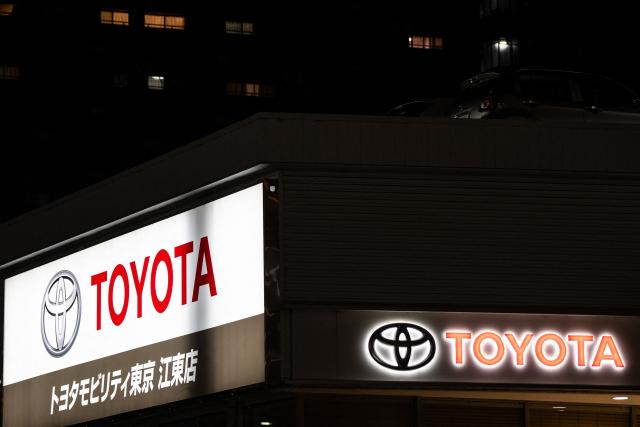 Toyota logos are seen on the side of a store in Tokyo on May 8, 2026. (Photo by Philip FONG / AFP)