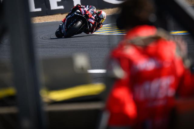Aprilia Racing's Italian rider Marco Bezzecchi corners during the first practice session ahead of the French Moto GP Grand Prix of France at Le Mans, northwestern France, on May 8, 2026. (Photo by Loic VENANCE / AFP)