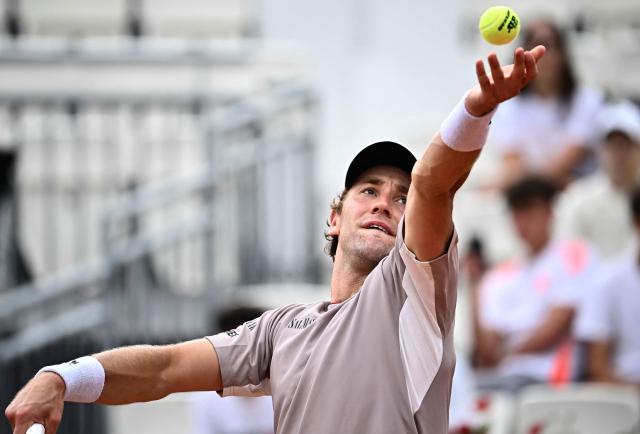 Norway's Casper Ruud serves to US Zachary Svajda during their men's singles match of the WTA Rome Open tennis tournament at the Foro Italico in Rome on May 8, 2026. (Photo by Filippo MONTEFORTE / AFP)