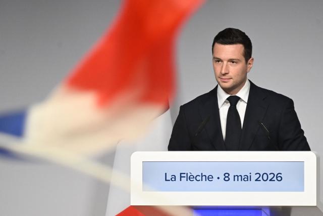 French far-right Rassemblement National RN party's President Jordan Bardella reacts as he delivers a speech following a ceremony marking the 81st anniversary of VE Day, or Victory in Europe Day, which commemorates the end of World War II, in La Fleche, north-western France, on May 8, 2026. (Photo by Sebastien Salom-Gomis / AFP)
