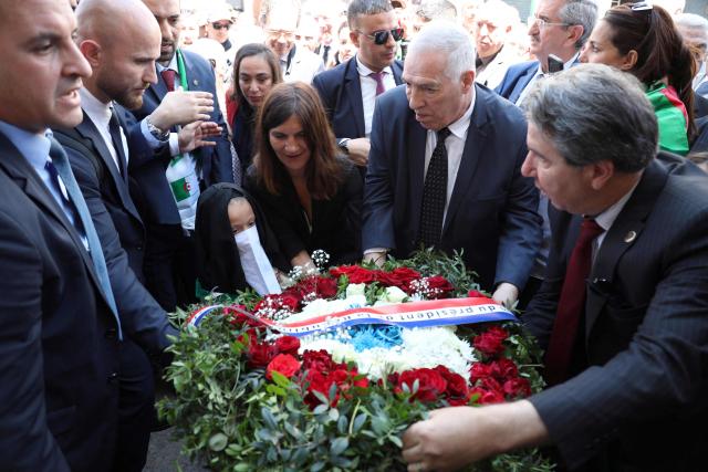 French Minister Delegate for the Armed Forces and Veterans Affairs Alice Rufo (C) and Algerian Minister of the Mujahideen and Beneficiaries Abdelmalek Tacherift (2ndR), lay a wreath during a commemoration ceremony marking the anniversary of the "1945 Setif massacres" in the eastern city of Setif on May 8, 2026. France announced on May 8,  the return of its ambassador to Algeria, coinciding with a ministerial visit aimed at “building trusting relations” and “restoring effective dialogue” with Algiers, following nearly two years of diplomatic crisis between the two countries. (Photo by AFP)