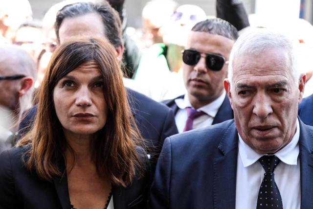 France's junior Minister for Veterans affairs Alice Rufo (L) stands next to Algerian Minister of the Mujahideen and Beneficiaries Abdelmalek Tacherift, during a commemoration ceremony marking the anniversary of the "1945 Setif massacres" in the eastern city of Setif on May 8, 2026. France announced on May 8,  the return of its ambassador to Algeria, coinciding with a ministerial visit aimed at “building trusting relations” and “restoring effective dialogue” with Algiers, following nearly two years of diplomatic crisis between the two countries. (Photo by AFP)