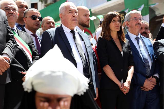 French Minister Delegate for the Armed Forces and Veterans Affairs Alice Rufo (2nd R) stands next to Algerian Minister of the Mujahideen and Beneficiaries Abdelmalek Tacherift (3rdR), during a commemoration ceremony marking the anniversary of the "1945 Setif massacres" in the eastern city of Setif on May 8, 2026. France announced on May 8,  the return of its ambassador to Algeria, coinciding with a ministerial visit aimed at “building trusting relations” and “restoring effective dialogue” with Algiers, following nearly two years of diplomatic crisis between the two countries. (Photo by AFP)