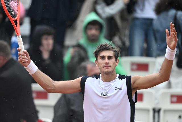 Italy's Matteo Arnaldi celebrates after winning against Australia's Alex de Minaur during their men's singles match of the WTA Rome Open tennis tournament at the Foro Italico in Rome on May 8, 2026. (Photo by Tiziana FABI / AFP)