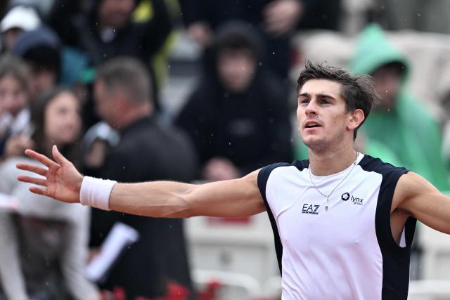 Italy's Matteo Arnaldi celebrates after winning against Australia's Alex de Minaur during their men's singles match of the WTA Rome Open tennis tournament at the Foro Italico in Rome on May 8, 2026. (Photo by Tiziana FABI / AFP)