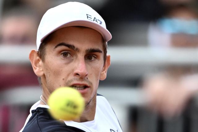 Italy's Matteo Arnaldi eyes the ball as he plays against Australia's Alex de Minaur during their men's singles match of the WTA Rome Open tennis tournament at the Foro Italico in Rome on May 8, 2026. (Photo by Tiziana FABI / AFP)
