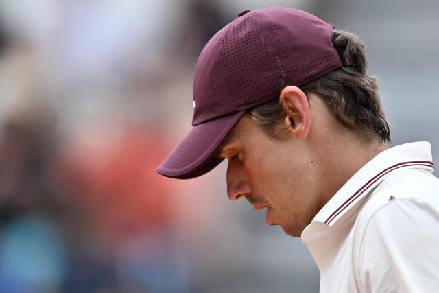 Australia's Alex de Minaur reacts as he plays against Italy's Matteo Arnaldi during their men's singles match of the WTA Rome Open tennis tournament at the Foro Italico in Rome on May 8, 2026. (Photo by Tiziana FABI / AFP)
