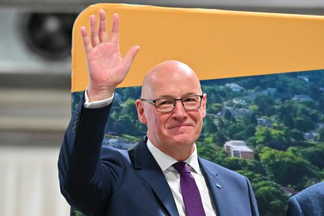 Scotland's First Minister and Scottish National Party (SNP) leader John Swinney reacts after winning his seat, at a vote-counting centre at the Dewars Centre in Perth, Perthshire, Scotland on May 8, 2026. (Photo by ANDY BUCHANAN / AFP)