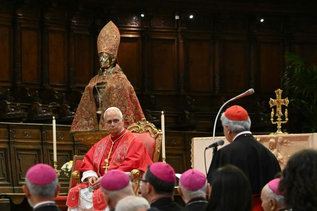 Pope Leo XIV sits in front of the statue of San Gennaro (Saint Januarius, patron of Naples) at Naples Cathedral as part of a pastoral visit in Naples on May 8, 2026. (Photo by Alberto PIZZOLI / AFP)