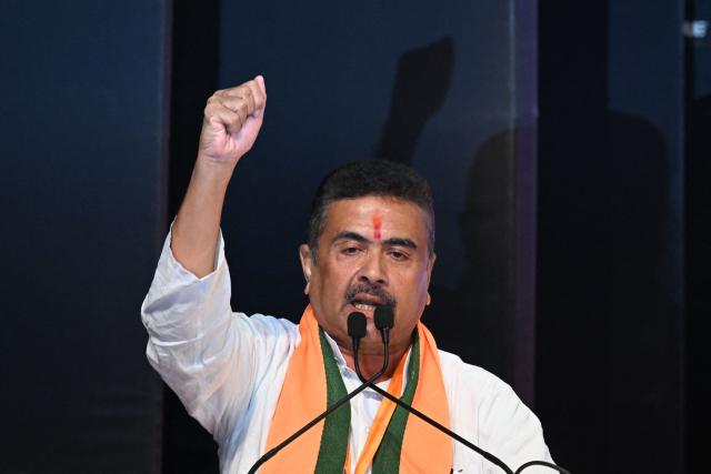 Bharatiya Janata Party (BJP) leader and newly selected Chief Minister of West Bengal Suvendu Adhikari gestures during a party meeting in Kolkata on May 8, 2025. (Photo by Dibyangshu SARKAR / AFP)