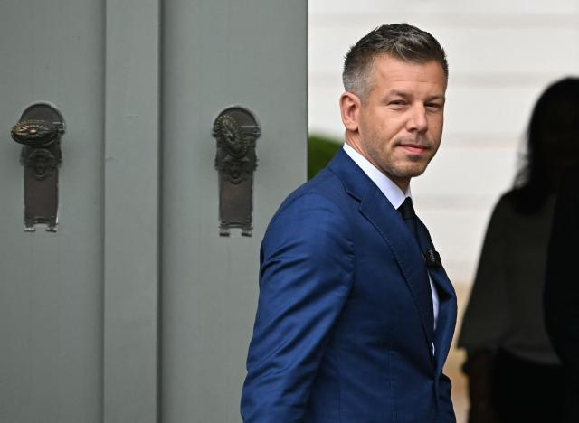 (FILES) Hungary's Prime minister-elect Peter Magyar arrives at the entrance of the Presidential Sandor Palace in Budapest on April 15, 2026 before meeting with Hungary's President and other parliamentary parties, three days after general elections in Hungary. Pro-European conservative Peter Magyar will be officially sworn in as Prime Minister by the Hungarian parliament on May 9, 2026, just under a month after his landslide victory in the parliamentary elections against nationalist Viktor Orban. (Photo by Attila KISBENEDEK / AFP)