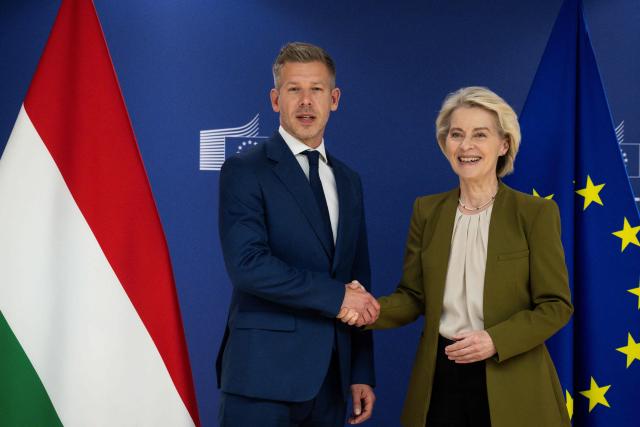 (FILES) European Commission President Ursula von der Leyen (R) shakes hands as she welcomes Hungary's incoming Prime Minister Peter Magyar (L) in Brussels on April 29, 2026. Pro-European conservative Peter Magyar will be officially sworn in as Prime Minister by the Hungarian parliament on May 9, 2026, just under a month after his landslide victory in the parliamentary elections against nationalist Viktor Orban. (Photo by JOHN THYS / POOL / AFP)