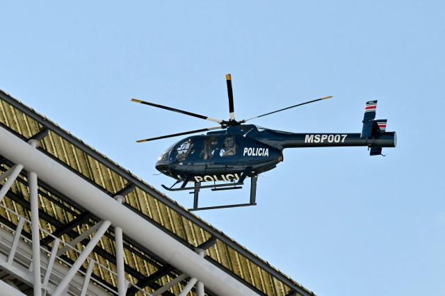 A police helicopter flies over the National Stadium ahead of the inauguration ceremony of Costa Rica's president-elect Laura Fernandez, in San Jose, on May 8, 2026. (Photo by MARTIN BERNETTI / AFP)