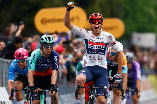 Soudal Quick-Step French rider Paul Magnier celebrates as he crosses the finish line to win the 1st stage of the Giro d'Italia 2026 - Tour of Italy cycling race between Nessebar and Burgas, Bulgaria, on May 8, 2026. (Photo by Luca Bettini / AFP)
