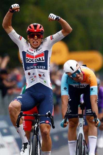 Soudal Quick-Step French rider Paul Magnier celebrates as he crosses the finish line to win the 1st stage of the Giro d'Italia 2026 - Tour of Italy cycling race between Nessebar and Burgas, Bulgaria, on May 8, 2026. (Photo by Luca Bettini / AFP)