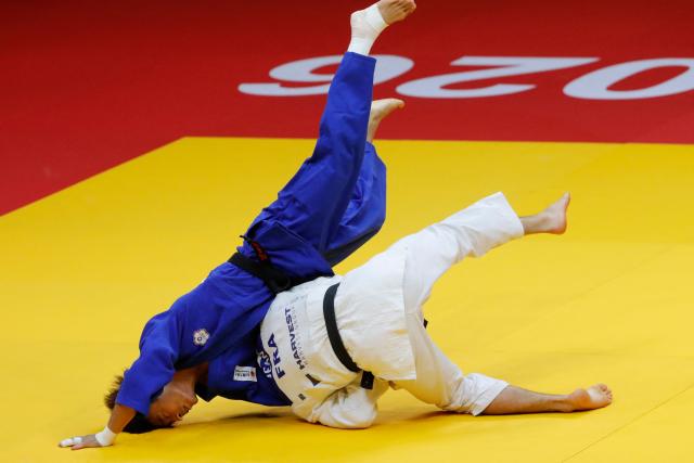 France's Enzo Jean (white) and Taiwan's Yang Yung-wei compete in the men's under 60 kg bronze medal bout at the Astana Grand Slam judo tournament in Astana on May 8, 2026. (Photo by STANISLAV FILIPPOV / AFP)