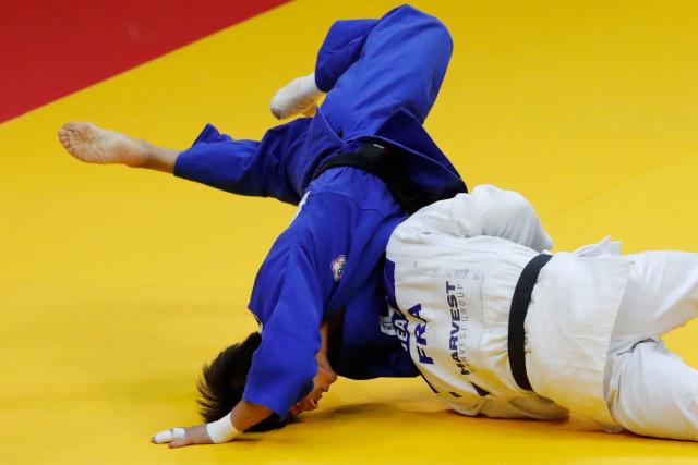 France's Enzo Jean (white) and Taiwan's Yang Yung-wei compete in the men's under 60 kg bronze medal bout at the Astana Grand Slam judo tournament in Astana on May 8, 2026. (Photo by STANISLAV FILIPPOV / AFP)