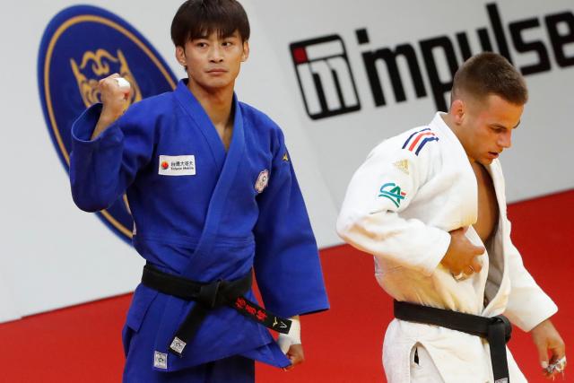 France's Enzo Jean (white) and Taiwan's Yang Yung-wei compete in the men's under 60 kg bronze medal bout at the Astana Grand Slam judo tournament in Astana on May 8, 2026. (Photo by STANISLAV FILIPPOV / AFP)