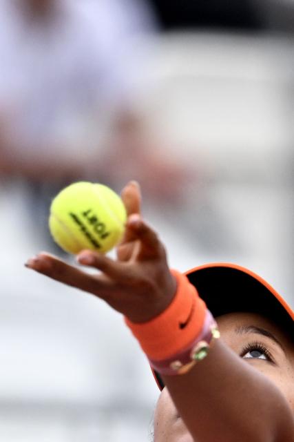 Japan's Naomi Osaka serves to Germany's Eva Lys during their women's singles match of the WTA Rome Open tennis tournament at the Foro Italico in Rome on May 8, 2026. (Photo by Tiziana FABI / AFP)