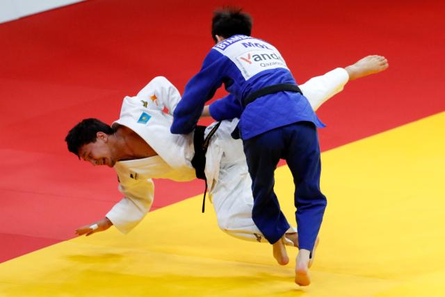 Kazakhstan's Talgat Orynbassar (white) and Mongolia's Sukhbat Byambasuren compete in the men's under 60 kg gold medal bout at the Astana Grand Slam judo tournament in Astana on May 8, 2026. (Photo by STANISLAV FILIPPOV / AFP)