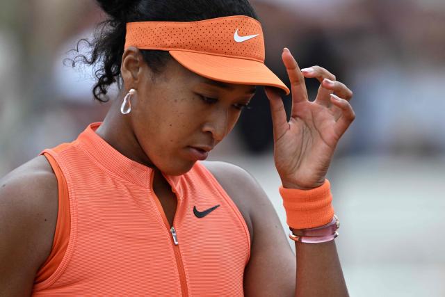 Japan's Naomi Osaka reacts as she plays against Germany's Eva Lys during their women's singles match of the WTA Rome Open tennis tournament at the Foro Italico in Rome on May 8, 2026. (Photo by Tiziana FABI / AFP)