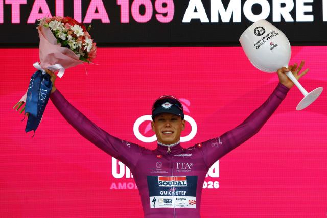 Soudal Quick-Step French rider Paul Magnier wearing the points classification mauve jersey (Maglia Ciclamino) poses on the podium after winning the 1st stage of the Giro d'Italia 2026 - Tour of Italy cycling race between Nessebar and Burgas, Bulgaria, on May 8, 2026. (Photo by Luca Bettini / AFP)