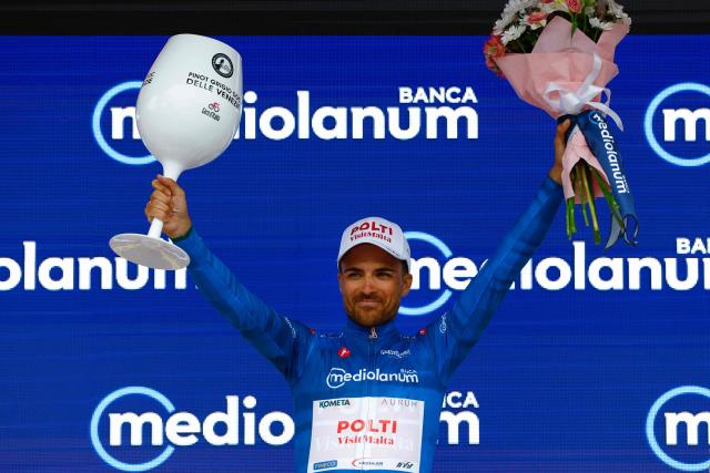 Team Polti VisitMalta Spanish rider Diego Sevilla wearing the best climber's blue jersey (Maglia Azzura) poses on the podium after the 1st stage of the Giro d'Italia 2026 - Tour of Italy cycling race between Nessebar and Burgas, Bulgaria, on May 8, 2026. (Photo by Luca Bettini / AFP)