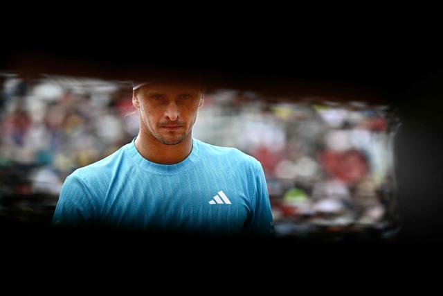 Germany's Alexander Zverev reacts as he plays against Germany's Daniel Altmaier during their men's singles match of the WTA Rome Open tennis tournament at the Foro Italico in Rome on May 8, 2026. (Photo by Filippo MONTEFORTE / AFP)