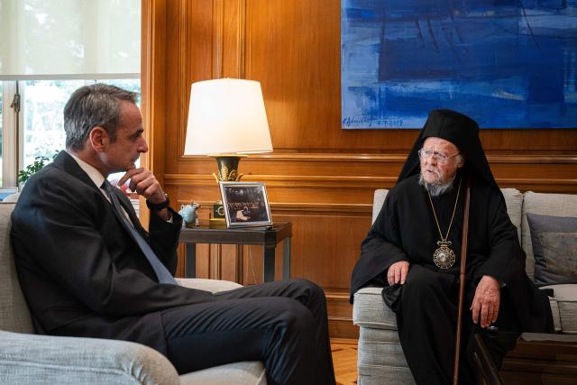 Ecumenical Patriarch Bartholomew I of Constantinople (R) speaks with Greece's Prime Minister Kyriakos Mitsotakis during their meeting  at Maximos Mansion in Athens, on May 8, 2026. (Photo by Angelos TZORTZINIS / AFP)
