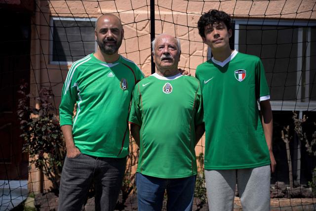 Mexican football fans (L to R) Victor Hugo Rueda alias "Jairo", Fernando Rueda, and Emilio Rueda pose for a portrait during an interview with AFP in Mexico City on March 21, 2026. The Ruedas, Fernando, Jairo and Emilio, are three generations of Mexicans who can no longer afford a World Cup ticket due to the surge in prices compared with the two previous tournaments hosted in the country. (Photo by Alfredo ESTRELLA / AFP)