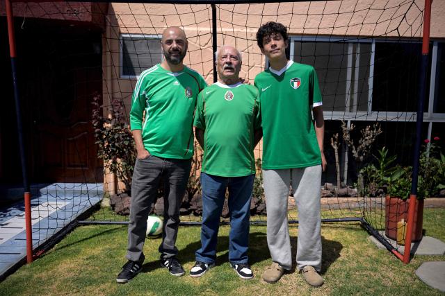 Mexican football fans (L to R) Victor Hugo Rueda alias "Jairo", Fernando Rueda, and Emilio Rueda pose for a portrait during an interview with AFP in Mexico City on March 21, 2026. The Ruedas, Fernando, Jairo and Emilio, are three generations of Mexicans who can no longer afford a World Cup ticket due to the surge in prices compared with the two previous tournaments hosted in the country. (Photo by Alfredo ESTRELLA / AFP)