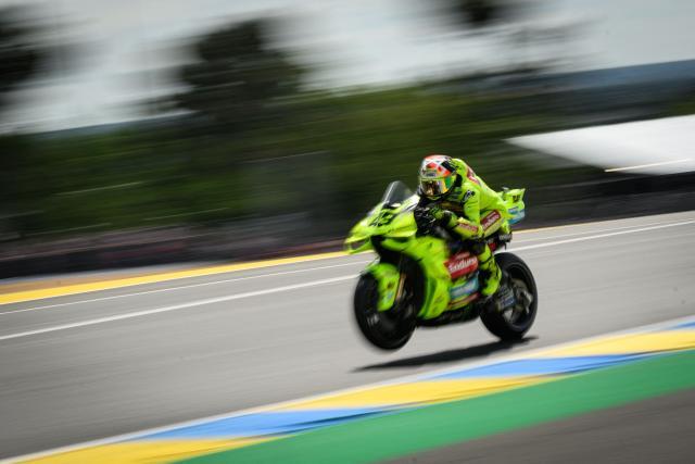 Pertamina Enduro VR46 Racing Team's Italian rider Fabio Di Giannantonio lifts his front wheel during the first practice session ahead of the French Moto GP Grand Prix of France at Le Mans, northwestern France, on May 8, 2026. (Photo by Loic VENANCE / AFP)