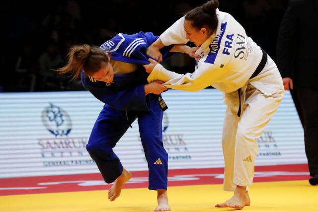 France's Faiza Mokdar (white) and France's Chloe Devictor compete in the women's under 57 kg gold medal bout at the Astana Grand Slam judo tournament in Astana on May 8, 2026. (Photo by STANISLAV FILIPPOV / AFP)