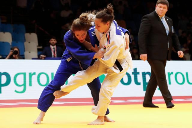 France's Faiza Mokdar (white) and France's Chloe Devictor compete in the women's under 57 kg gold medal bout at the Astana Grand Slam judo tournament in Astana on May 8, 2026. (Photo by STANISLAV FILIPPOV / AFP)