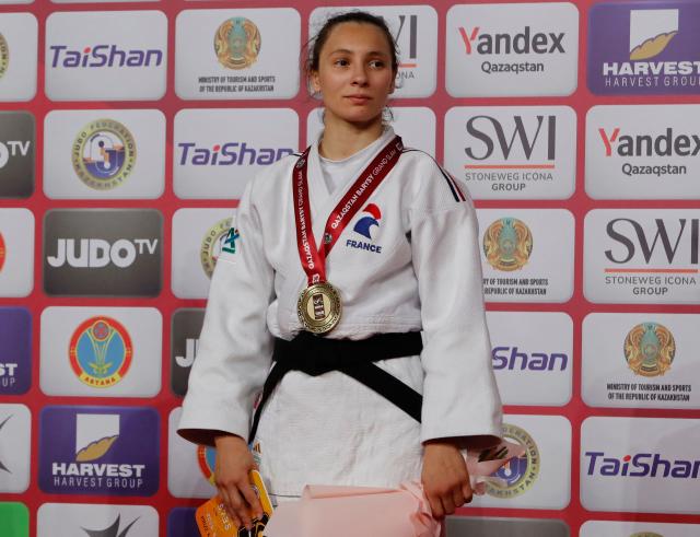 Gold medallist France's Faiza Mokdar celebrates during the podium ceremony for the women's under 57 kg event at the Astana Grand Slam judo tournament in Astana on May 8, 2026. (Photo by STANISLAV FILIPPOV / AFP)