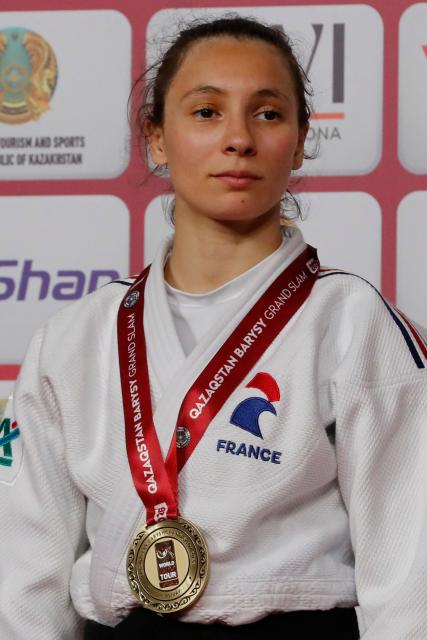 Gold medallist France's Faiza Mokdar celebrates during the podium ceremony for the women's under 57 kg event at the Astana Grand Slam judo tournament in Astana on May 8, 2026. (Photo by STANISLAV FILIPPOV / AFP)