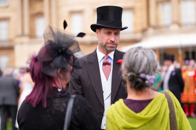 Britain's Prince William, Prince of Wales talks to guests during a Royal Garden Party at Buckingham Palace, in London, on May 8, 2026. (Photo by Aaron Chown / POOL / AFP)