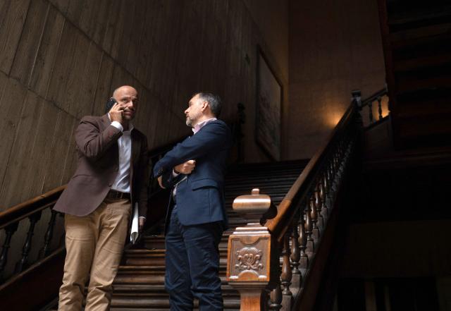 Canary Islands Government's spokesperson Alfonso Cabello (L) and Mayor of Santa Cruz de Tenerife Jose Manuel Bermudez talk after the authorities meet to manage the arrival of the Cruise MV Hondius at Granadilla de Abona port, in Santa Cruz de Tenerife on May 8, 2026. The evacuation of a hantavirus-hit cruise ship in the Canary Islands must take place between May 10 and May 11 because adverse weather conditions will force it to leave, the Spanish archipelago's regional government said. (Photo by JORGE GUERRERO / AFP)